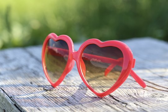 red heart shaped sunglasses in the sun