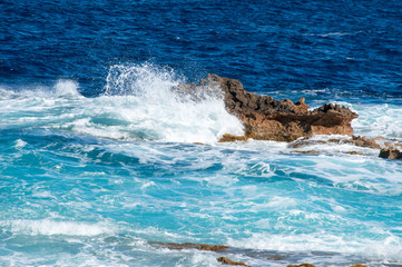 A wave and rocks at Malta near Cirkewwa Ferry Terminal.