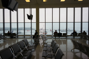 Waiting room with passengers in the airport