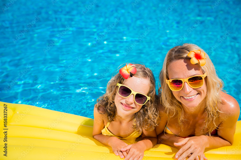 Wall mural happy family having fun on summer vacation