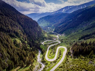 Fototapete Rund Transfagarasan Romania winding road aerial view © Calin Stan