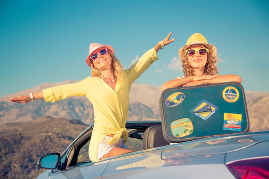 Happy family travel by car in the mountains