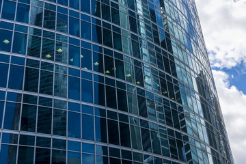 Fototapeta na wymiar Windows of skyscraper business office