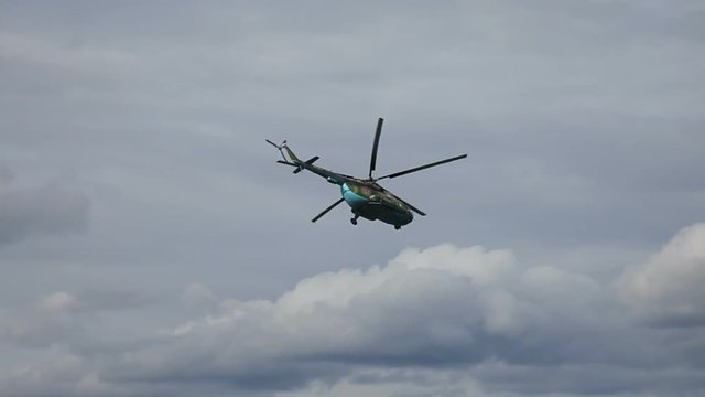 Russian army Mi-8 helicopter in action against cloudy sky