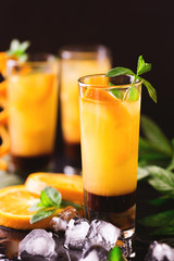 Aperitif with vodka, orange juice, chocolate and mint.