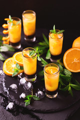 Aperitif with vodka, orange juice, chocolate and mint.