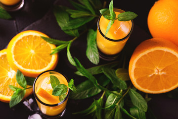 Aperitif with vodka, orange juice, chocolate and mint.