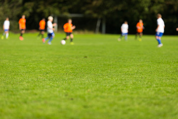 Obraz na płótnie Canvas Blurred youth soccer players