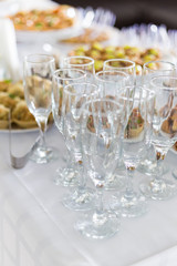 A small table with a delicious buffet of canapes, caviar, sandwiches