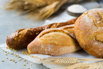Freshly baked traditional wheat bread and wheat ears
