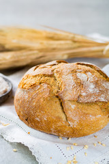 Freshly baked traditional wheat bread and wheat ears
