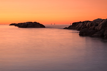 Fototapeta na wymiar Orange sunset in front of the sea