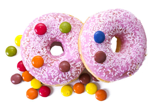 Donuts with candies isolated on white