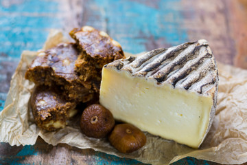 Ancient french cheese Tomme de Montagne and dried figs with figs bread