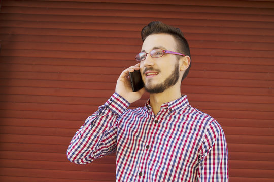 Hipster man talking on the cellphone
