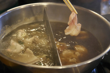 Shabu slices in the boiler, hot soup.