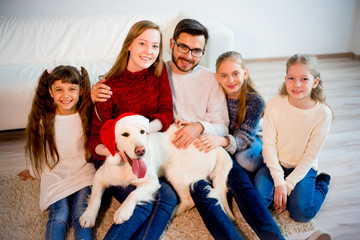 Family playing with a dog