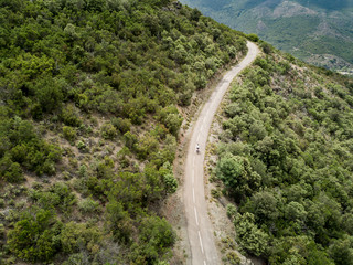 Aerial view of cyclist on a lonely small road