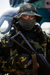 Photo of a soldier with an automatic rifle