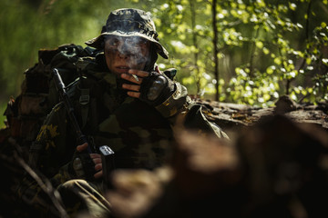 Soldier smokes after battle