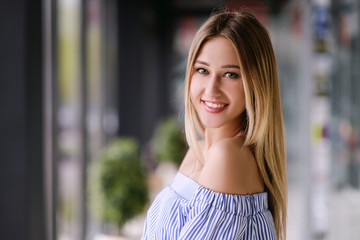 Beautiful blonde girl posing portrait indoors