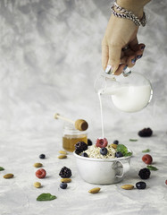 Healthy breakfast with oat flakes, raspberry berries, blueberries, selective focus