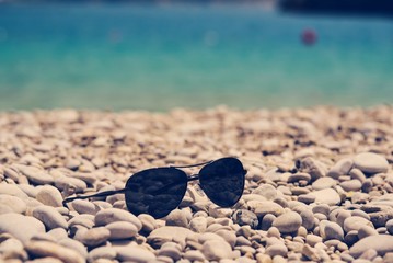 Glasses on the pebbles beach