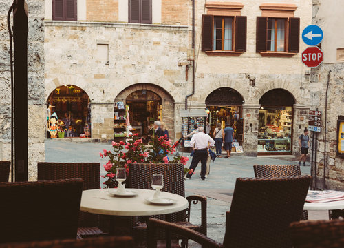 Old street in San Gimignano in evening, Tuscany, Italy. San Gimignano is typical Tuscan medieval town in Italy