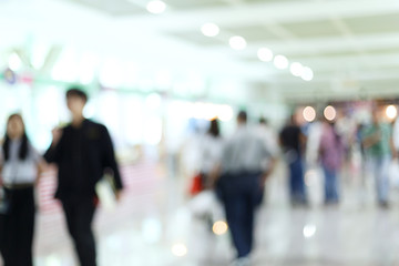 crowd people traveler in airport terminal, image blur used background