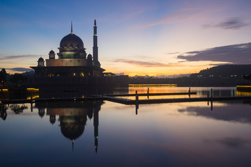 Sunrise moment at Putra Mosque, a principal mosque of Putrajaya, Malaysia. Construction of the mosque began in 1997 and was completed two years later.