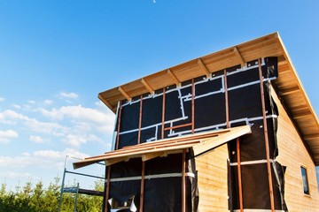 Polystyrene insulation of wood buildings. Eco-friendly building insulation.