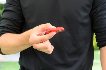 boy playing with a fidget spinner