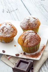 Muffins on a wooden table
