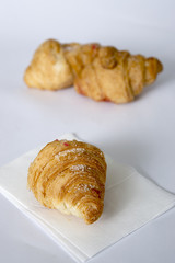 Fresh croissants in powder