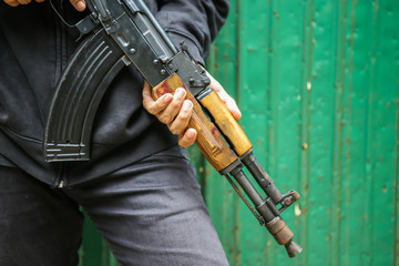 Man hold assault rifles