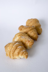 Sweet croissants on a white background