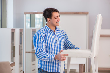 Fototapeta premium Young man shopping in furniture store