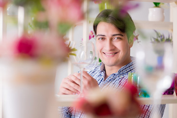 Young handsome man shopping in shop