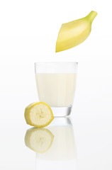 banana juice in glass isolated on white background