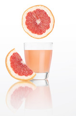 grapefruit juice in glass isolated on white background
