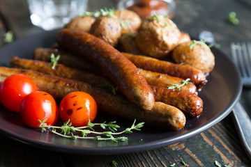 Fried sausages with baked potatoes