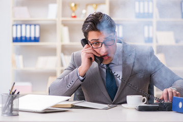 Businessman during fire alarm in office