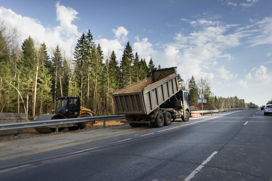 A lorry with tipping trailer in motion on the motorway