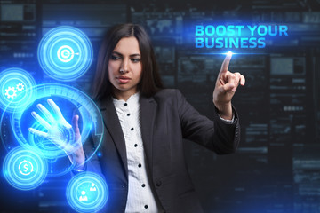 The concept of business, technology, the Internet and the network. A young entrepreneur working on a virtual screen of the future and sees the inscription: Boost your business