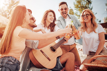 Group of young people having fun on the beach