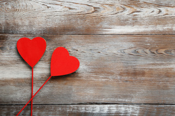 Love hearts on a brown wooden table