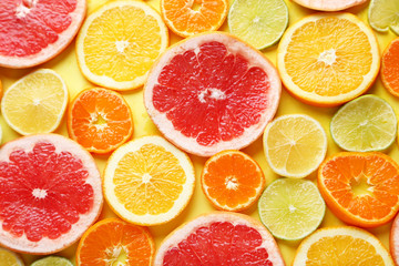 Citrus fruits on a yellow background