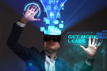Business, Technology, Internet and network concept. Young businessman working in virtual reality glasses sees the inscription: Get more leads