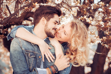 Fototapeta premium Cute couple in the park on a sunny day