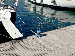 The pier and the catwalk of a sailboat. 